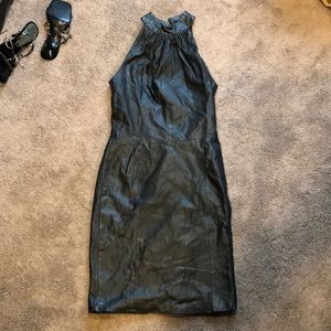 Leather tank top dress with high neck.
